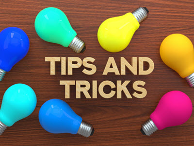 7 brightly colored lightbulbs on a wooden background with the words tips and tricks