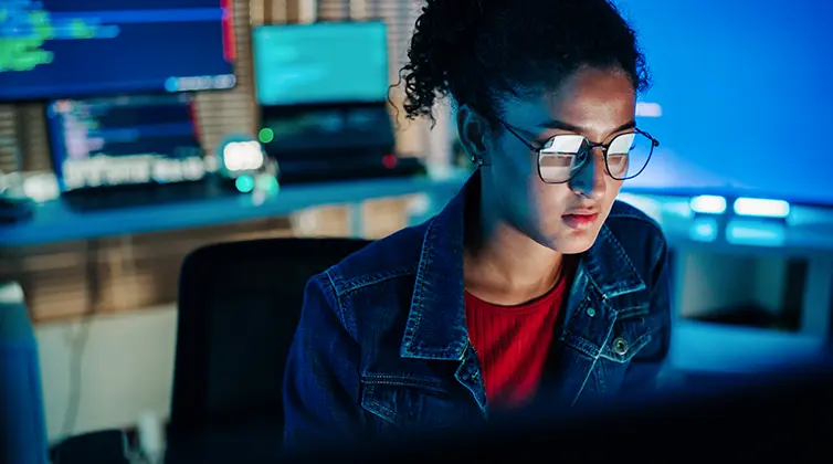 computer science professional working on laptop