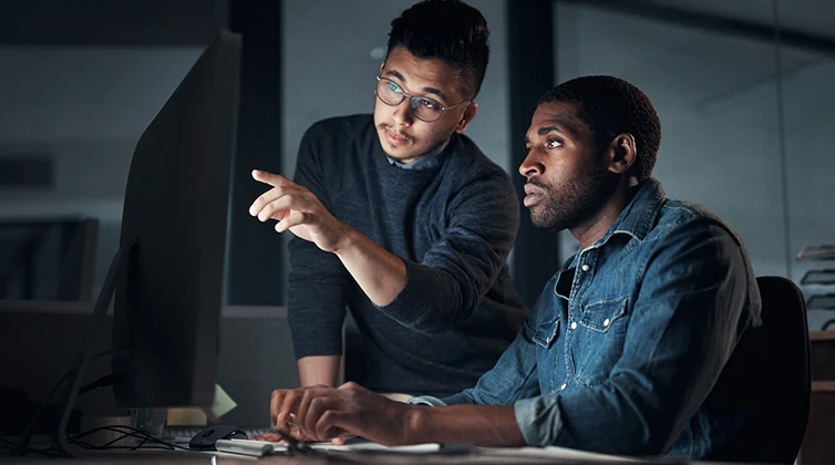 intelligence studies students looking at computer screen