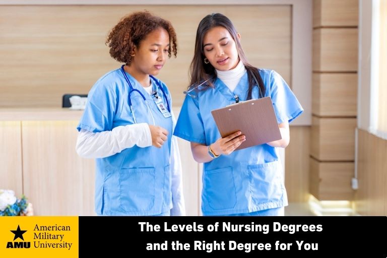 two female nurses looking at chart