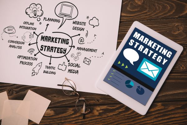 marketing strategy charted on paper and ipad