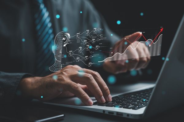 business analytics degree student working on laptop