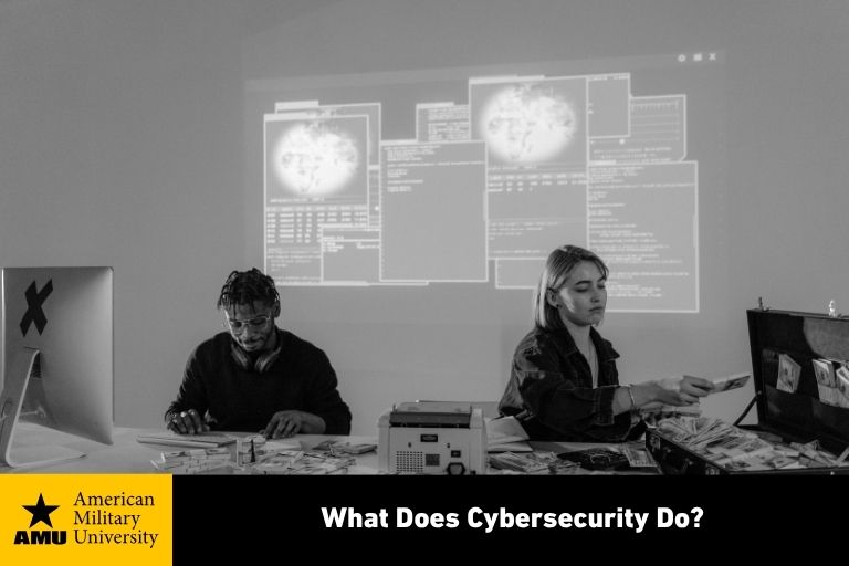 what-does-cybersecurity-do cybersecurity professionals working on laptops