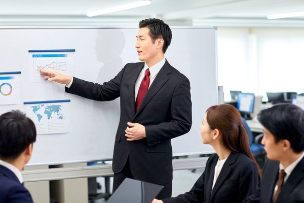 business degree graduate presenting data