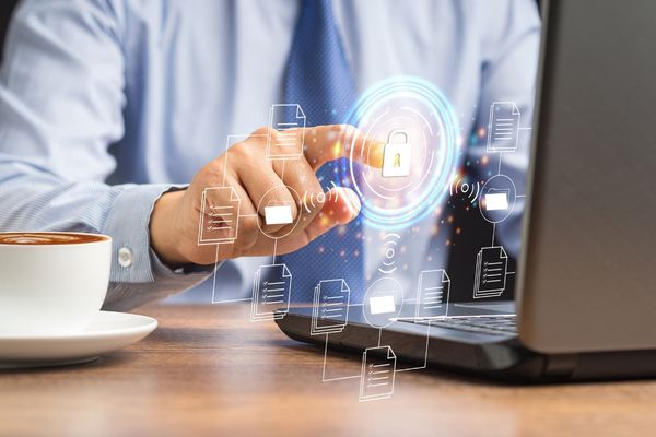 security management professional working on laptop